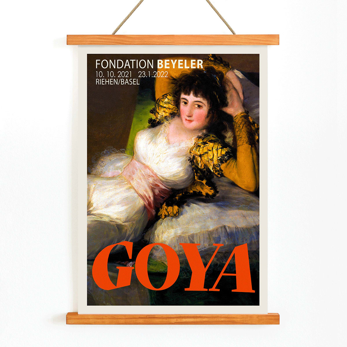 The Clothed Maja exhibition poster by Francisco Goya at Fondation Beyeler showing a reclining woman in a white and gold dress with yellow sleeves, with wooden magnetic frame on white background