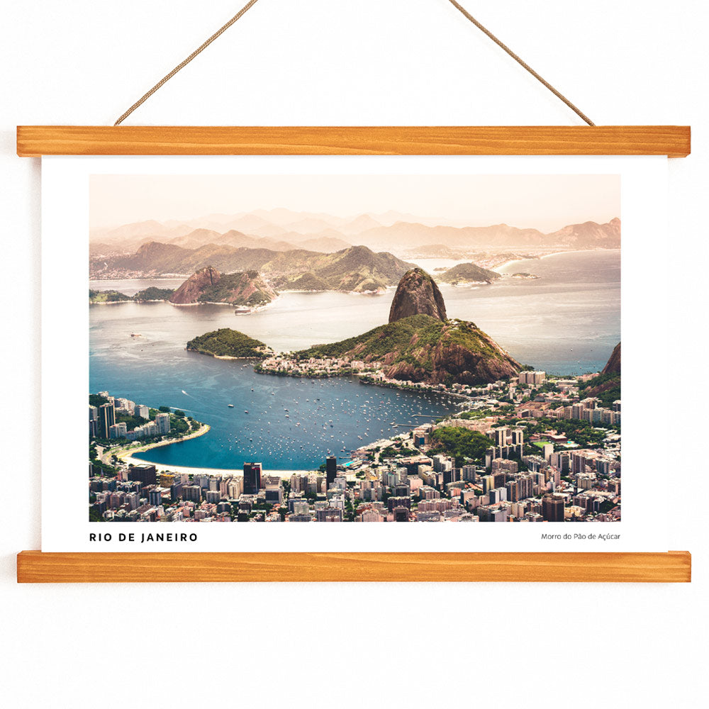 Aerial view of Rio de Janeiro with beaches buildings boats blue waters and mountains including Morro do Pao de Acucar poster artwork, with wooden magnetic frame on white background