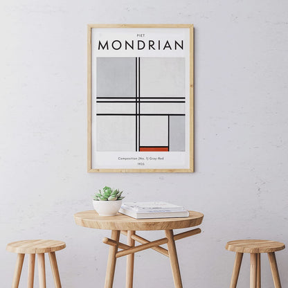 Geometric abstract artwork poster with black lines and color blocks by Piet Mondrian Composition No 1 Gray-Red, framed and displayed in home decor