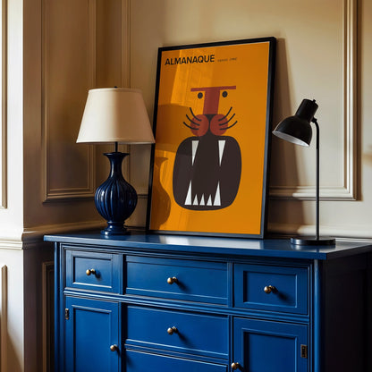 Almanaque magazine cover by Sebastiao Rodrigues with abstract animal and face artwork on orange background, framed and displayed in home decor
