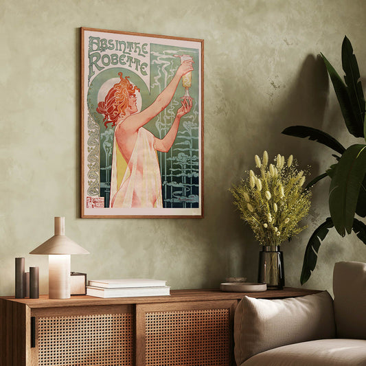 Art Nouveau poster Absinthe Robette by Privat-Livemont featuring a woman holding a glass of absinthe with stylized smoke, framed and displayed in home decor