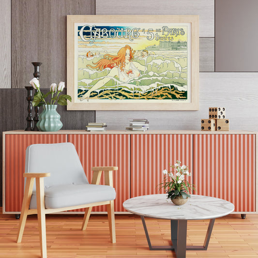 Art Nouveau poster of a red haired woman with flowing hair swimming in the sea near Casino De Cabourg by Henri Privat Livemont, framed and displayed in home decor