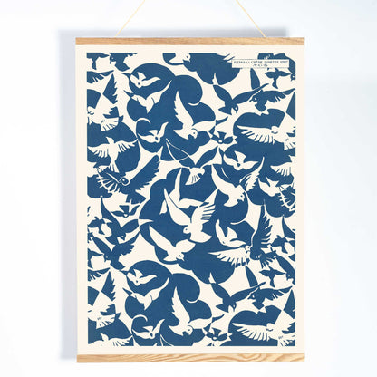 Charles Goy Lesbesse crepe poster with stylized birds in bold blue and cream minimalist design, with wooden magnetic frame on white background
