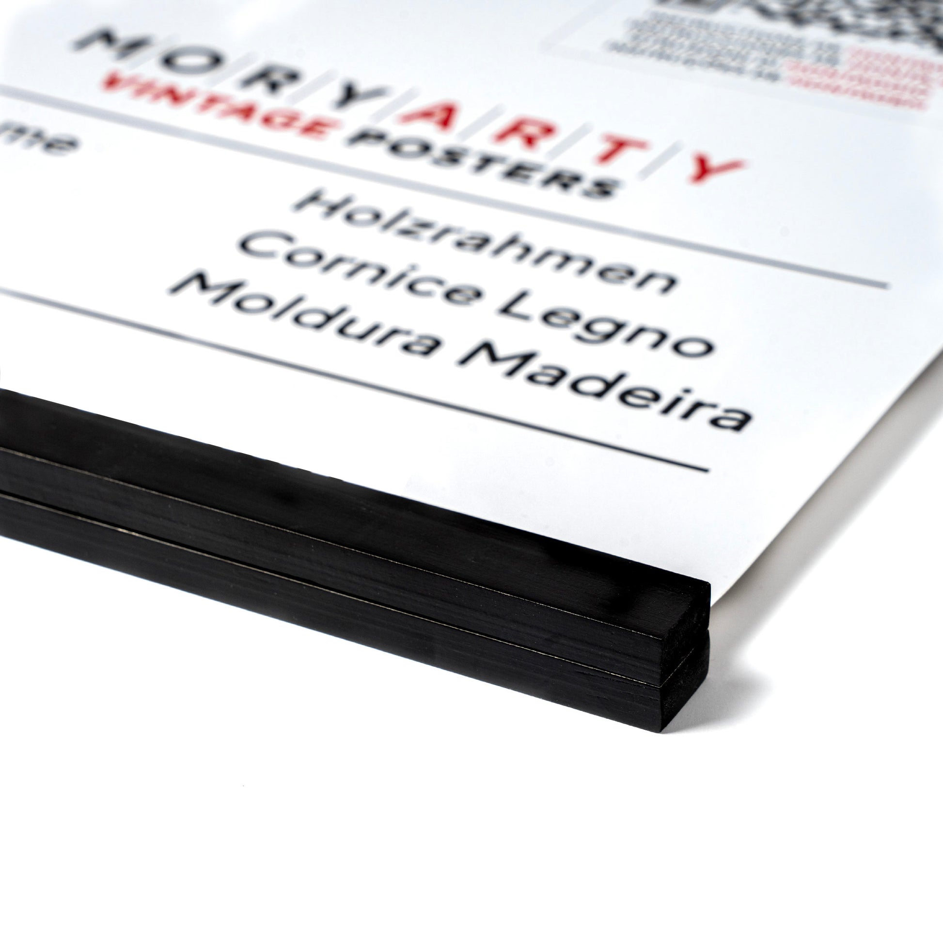 Black Pine magnetic wood frame with two sleek wooden bars and a simple rope for hanging, displaying a poster on a wall in a modern, elegant setting, front corner closeup picture