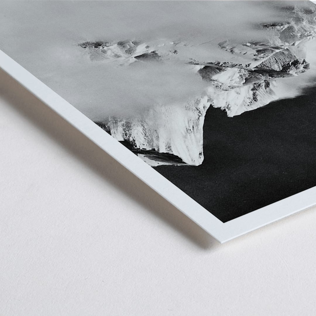 Closeup detail of Broad Peak mountain view from Godwin-Austen Glacier snow-covered and obscured by clouds photo by Vittorio Sella