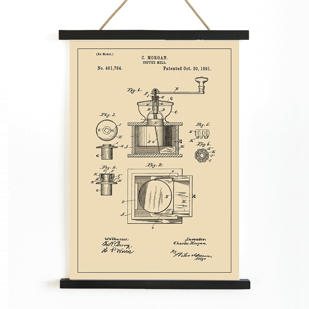 Vintage mechanical drawing and patent sketch of a coffee grinder titled Coffee Mill by C Morgan featuring detailed illustrations and technical specifications, with wooden magnetic frame on white background