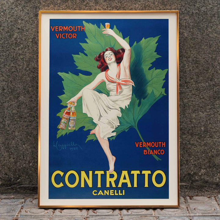 Leonetto Cappiello Contratto Canelli poster of a woman raising a glass above vermouth bottles with green vine leaves, framed and displayed in home decor