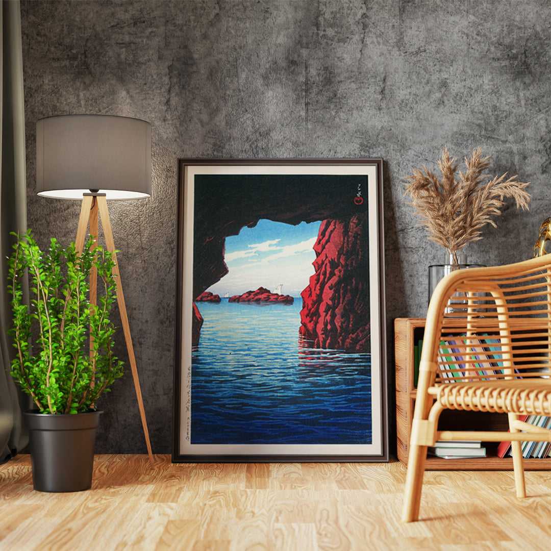 Kojaku Cavern Oga Peninsula sea cave with blue water and red cliffs vibrant sea cliffs and water by Kawase Hasui, framed and displayed in home decor