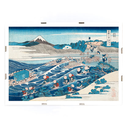 Travelers crossing a river with Mount Fuji in the background in Tokaido Kanaya no Fuji by Katsushika Hokusai poster, framed and displayed in modern living room decor