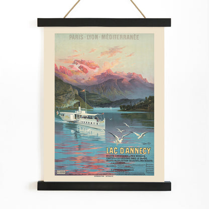 Poster of Le Lac d Annecy by Frederic Hugo d Alesi showing a scenic mountain lake with boat and seagulls at sunset, with wooden magnetic frame on white background