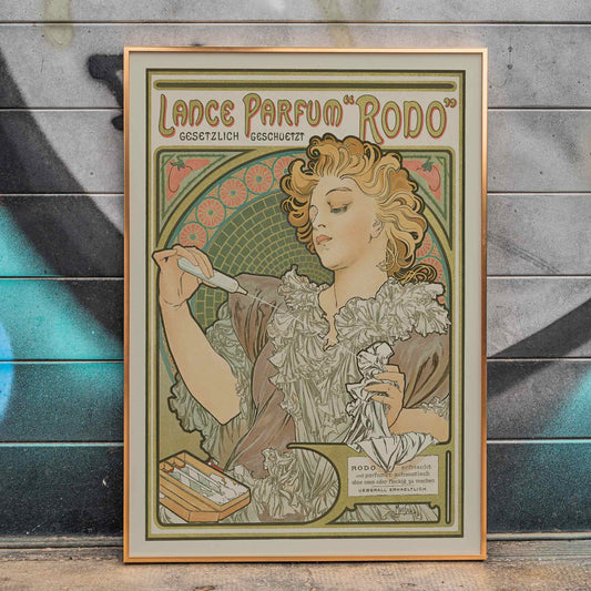 Alphonse Mucha Lance parfum Rodo poster Art Nouveau woman with flowing hair floral border soft green gold tones, framed and displayed in home decor