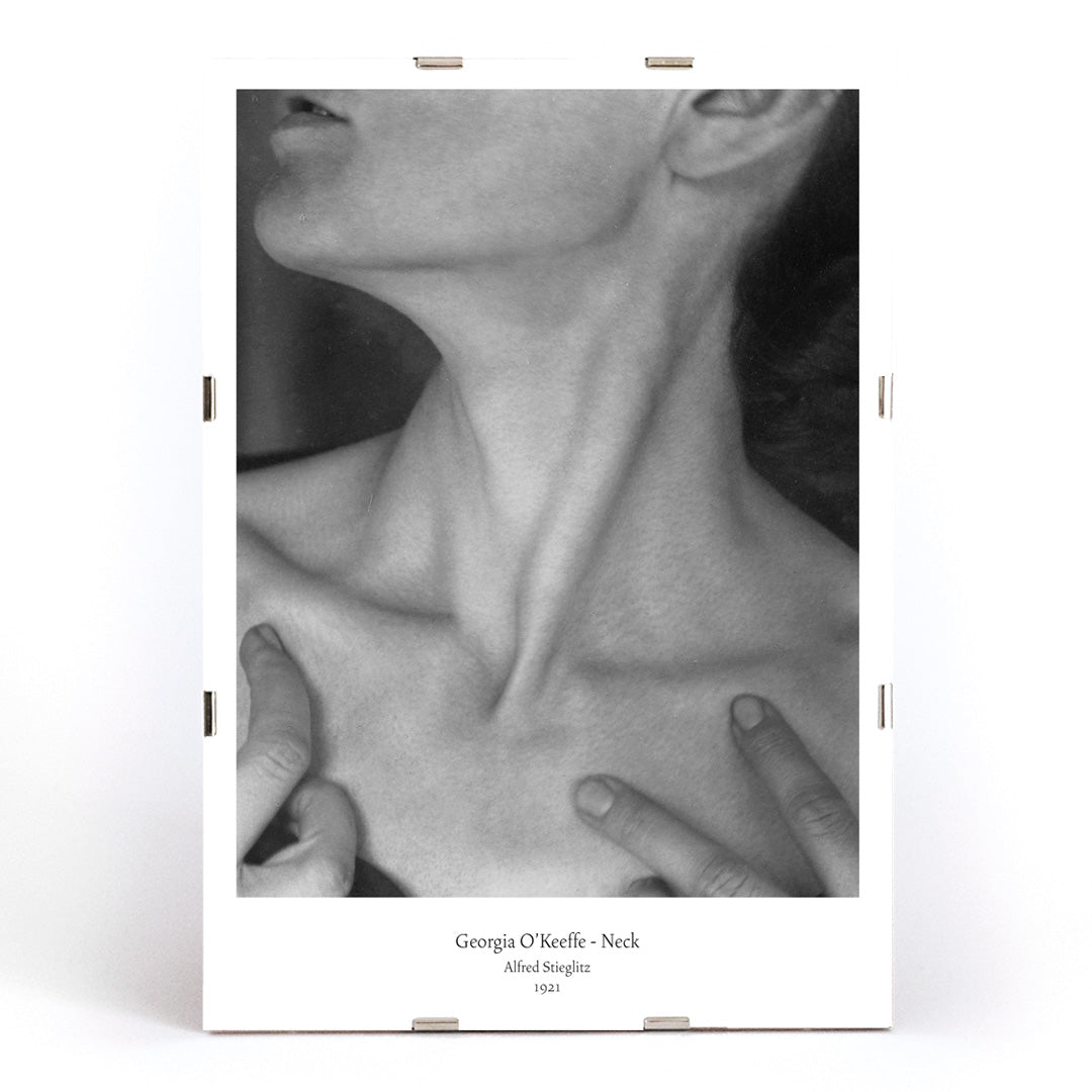 Black and white portrait of Georgia O Keeffe neck and hands by Alfred Stieglitz wall art poster photography decor, framed and displayed in modern living room decor
