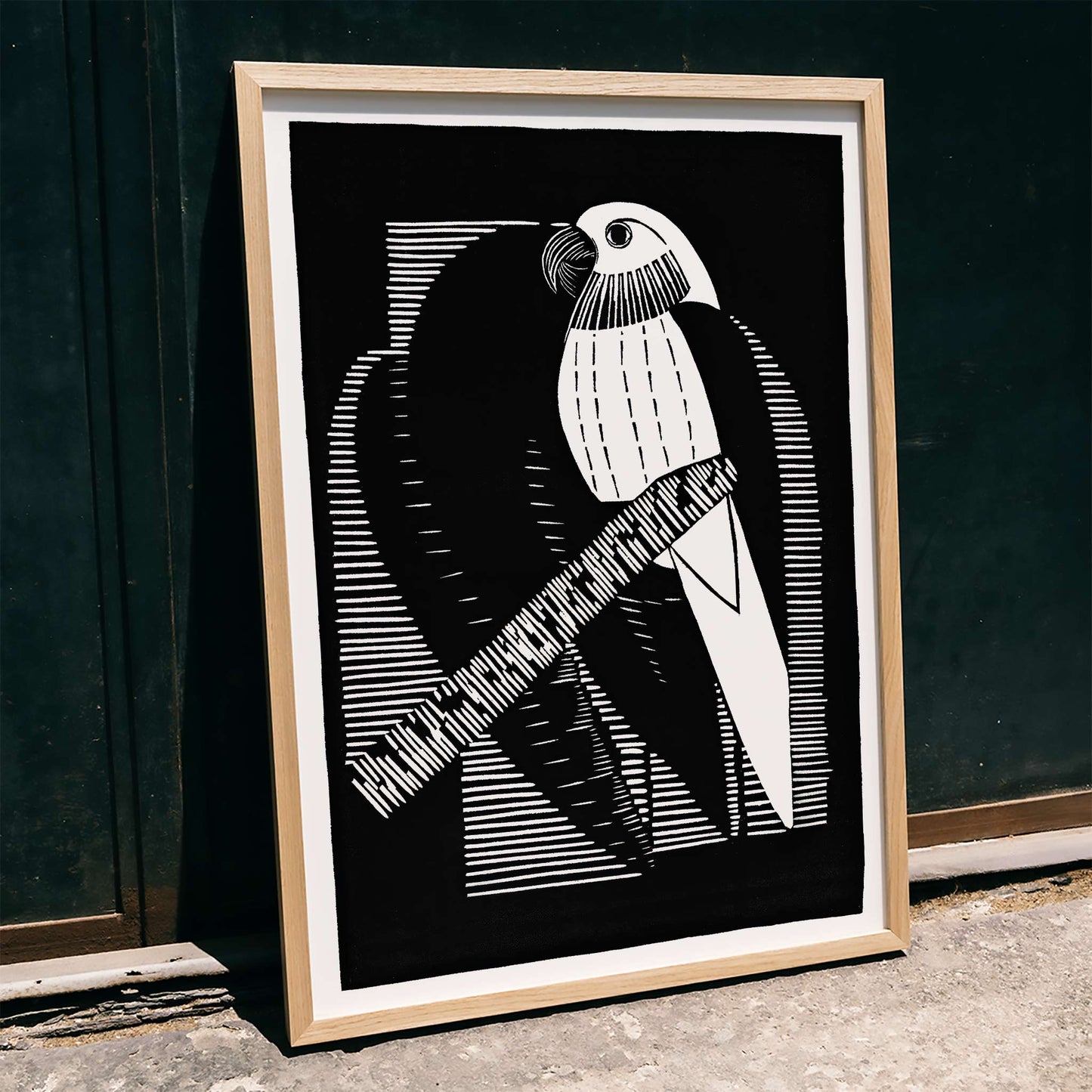 Black and white geometric parakeet artwork by Samuel Jessurun de Mesquita titled Parakeets Parkieten poster featuring parakeet on branch, framed and displayed in modern living room decor