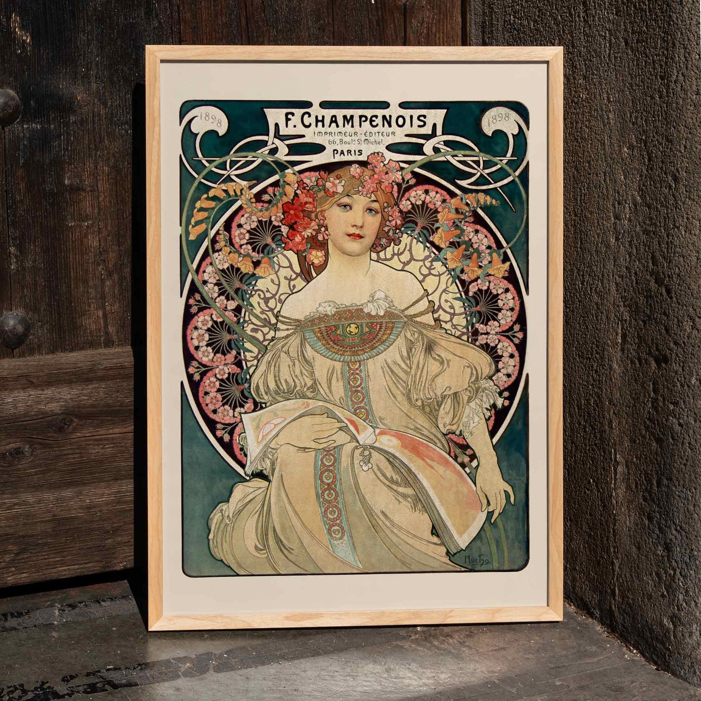Art Nouveau poster by Alphonse Mucha featuring an elegant woman in a floral dress with flowers in her hair Affiche Champenois Imprimeur, framed and displayed in home decor