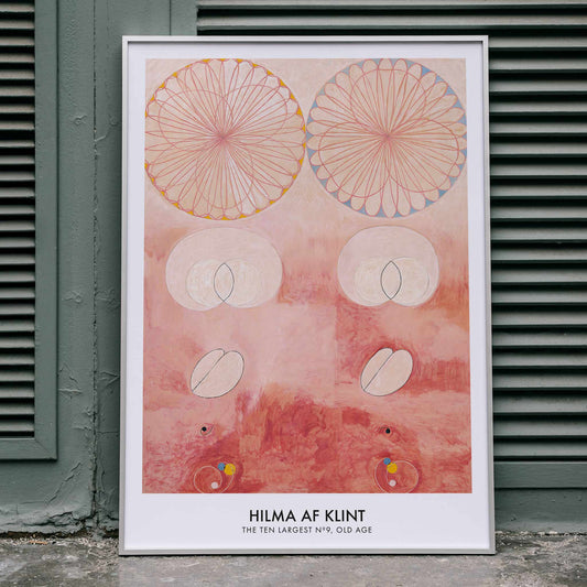 Abstract geometric and circular patterns in pink and orange from The Ten Largest Old Age by Hilma af Klint art poster, framed and displayed in home decor