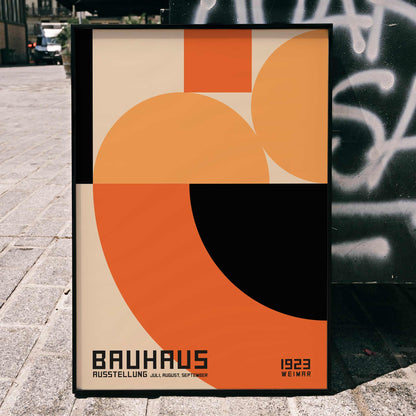 Bauhaus Poster 4 inspired by the Weimar Exhibition featuring abstract geometric shapes in orange and black by unknown artist, framed and displayed in home decor