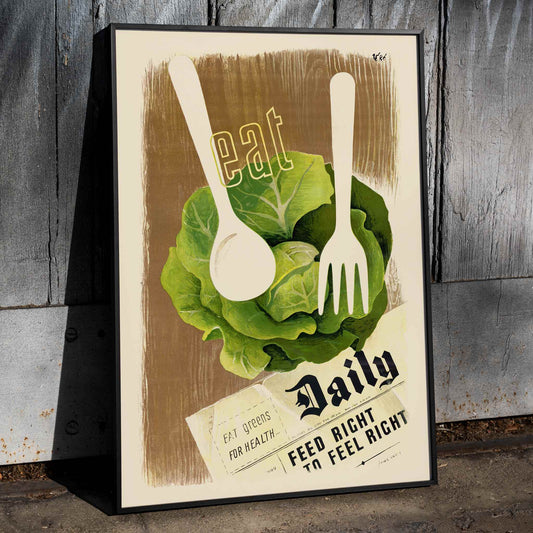 Eat Greens for Health Feed Right to Feel Right by Hans Schleger poster featuring lettuce head and utensils promoting healthy eating, framed and displayed in home decor