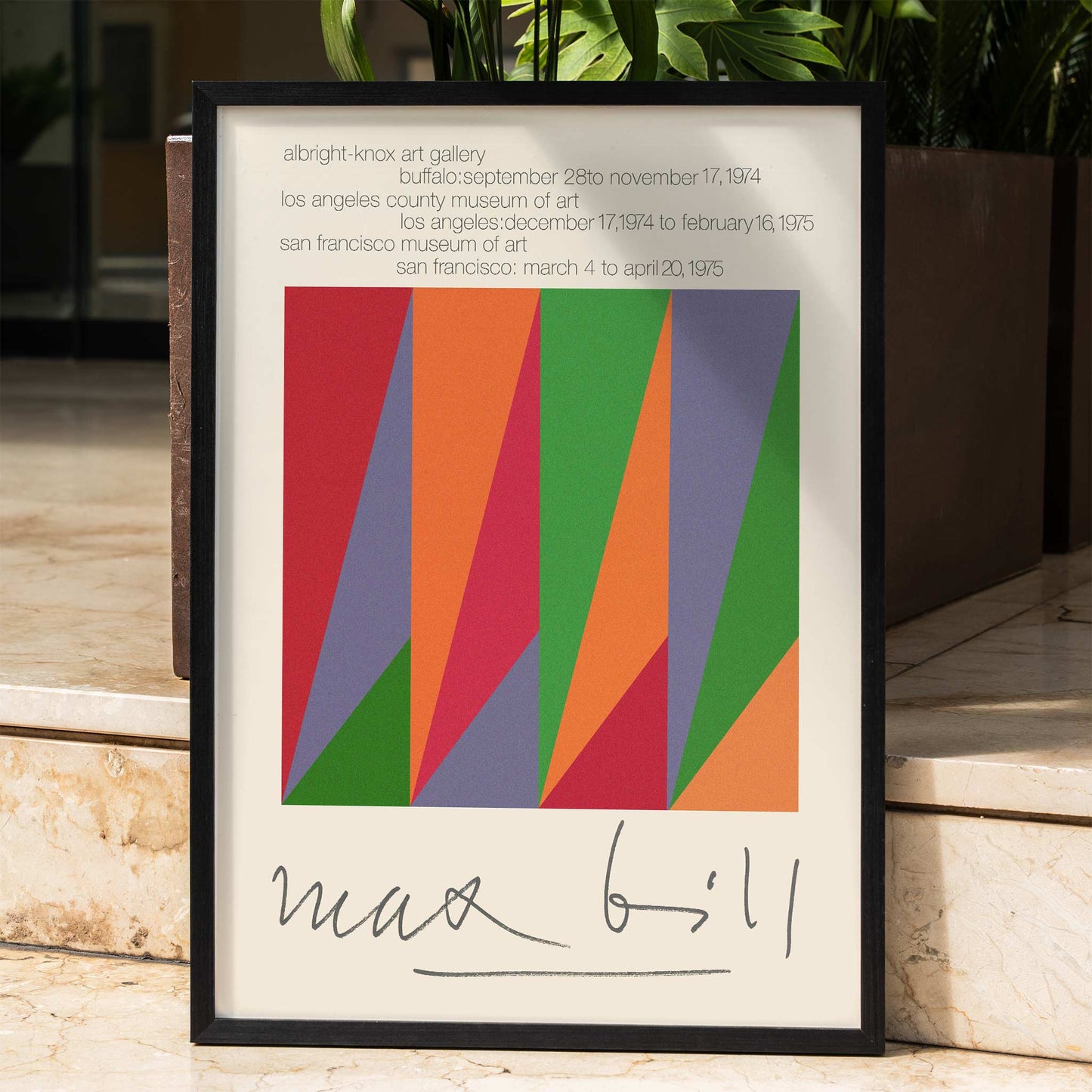 Colorful geometric design and shapes by Max Bill on serigraph silkscreen exhibition poster titled Serigraph Silkscreen with signature in black frame, framed and displayed in home decor