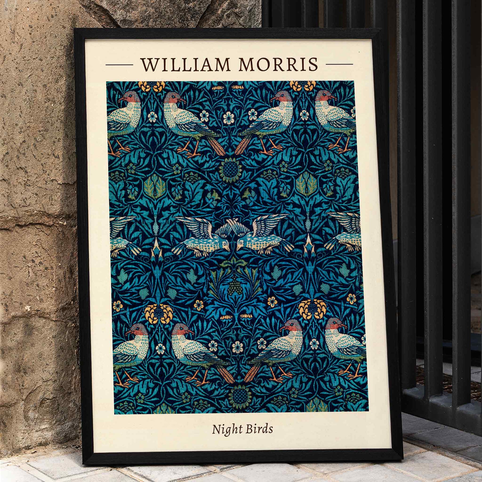 Night Birds by William Morris colorful patterned illustration and poster with intricate birds and floral designs in rich blue and green tones, framed and displayed in home decor