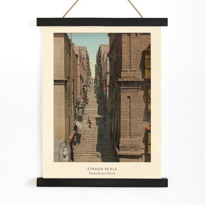 Steep stone staircase and historic street scene with people in Valletta Strada Reale by Photochrom Zurich, with wooden magnetic frame on white background