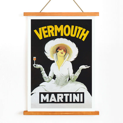 Vermouth Martini by Marcello Dudovich vintage poster art featuring an elegant woman in white holding a glass against a black background, with wooden magnetic frame on white background