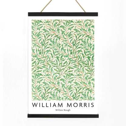 Willow Bough by William Morris leafy botanical pattern poster with intricate green willow branches and leaves on light background, with wooden magnetic frame on white background